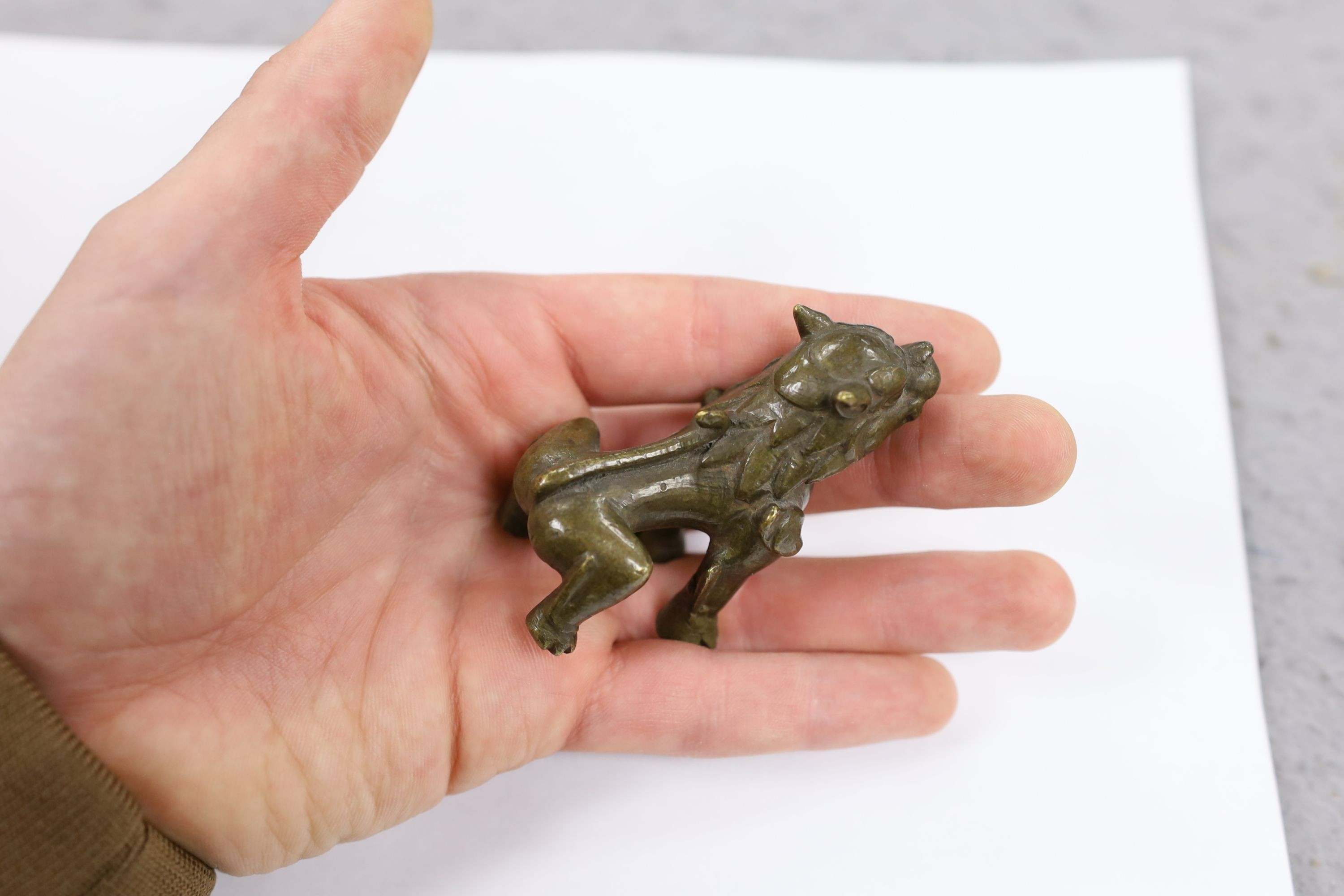 Five Chinese or Tibetan bronze figures or Buddhist implements, tallest 13cms high